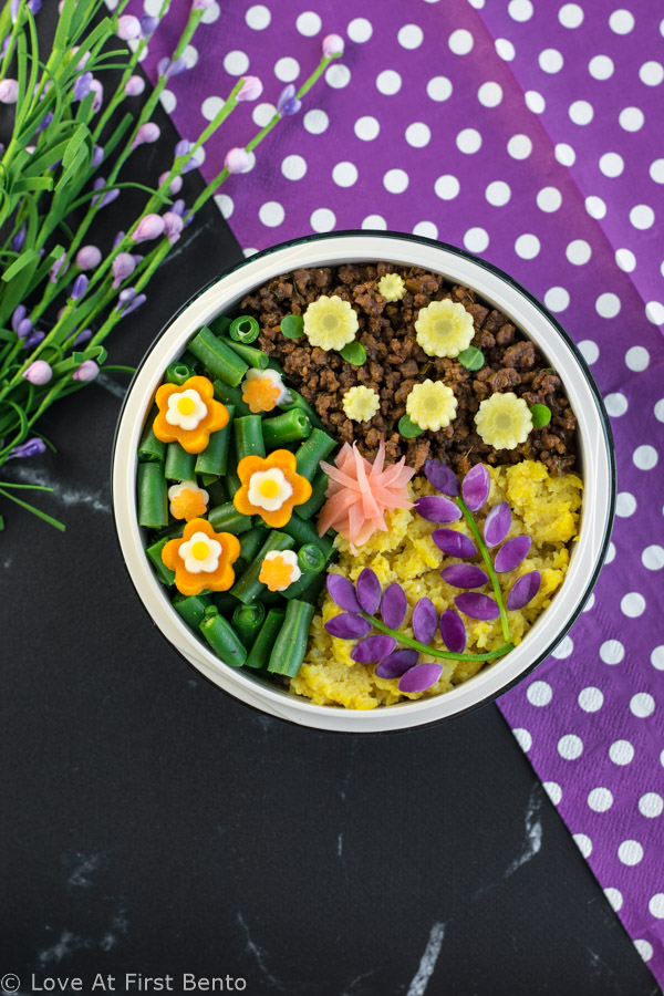 Flower Garden Soboro Bento Box - Learn how to easily make a beautiful flower garden soboro bento that's almost too pretty to eat! Plus, a secret tip that makes decorating even easier. Recipe at loveatfirstbento.com