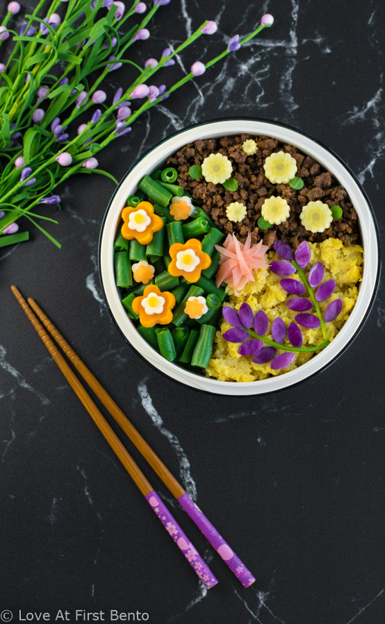 Flower Garden Soboro Bento Box - Learn how to easily make a beautiful flower garden soboro bento that's almost too pretty to eat! Plus, a secret tip that makes decorating even easier. Recipe at loveatfirstbento.com