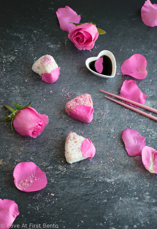 Salted Rose Onigiri - WOW your friends with the unique flavor of pickled rose petals, which take these rice balls to a whole new level of edible elegance! Plus, I reveal a super easy, 2-ingredient rose salt recipe perfect for sprinkling on top. These onigiri are absolutely perfect for a Mother's Day or spring bento box - a guaranteed crowd-pleaser! Get the recipe at loveatfirstbento.com