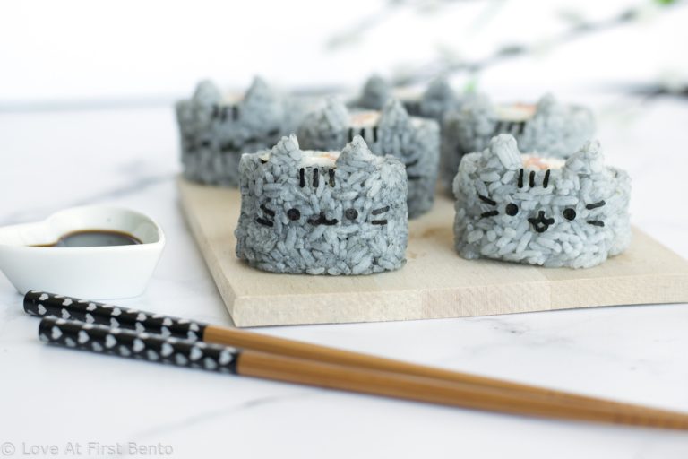 pusheen holding sushi