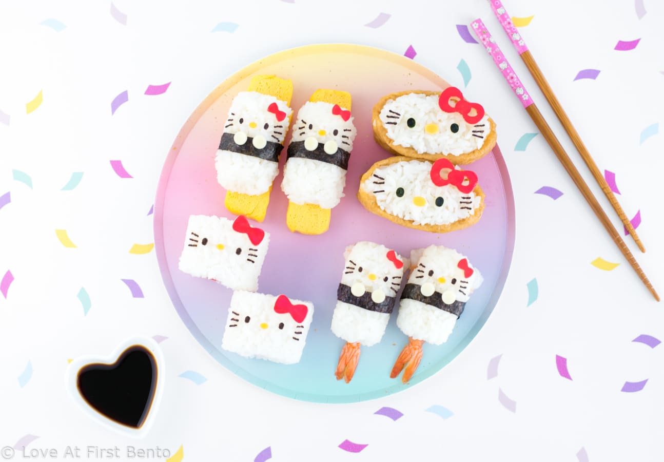 Hello Kitty Sushi Party - The perfect way to celebrate International Sushi Day! These 5 adorable Hello Kitty sushi designs are a Hello Kitty fan's dream come true, and a truly almost too cute to eat! Even complete beginners can learn how to make these Hello Kitty sushi from start to finish - find out how by visiting loveatfirstbento.com