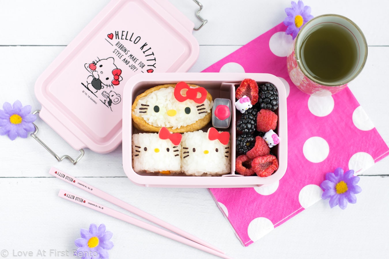 Hello Kitty Sushi Party Bento - The perfect way to celebrate International Sushi Day! These 5 adorable Hello Kitty sushi designs are a Hello Kitty fan's dream come true, and a truly almost too cute to eat! Even complete beginners can learn how to make these Hello Kitty sushi from start to finish - find out how by visiting loveatfirstbento.com